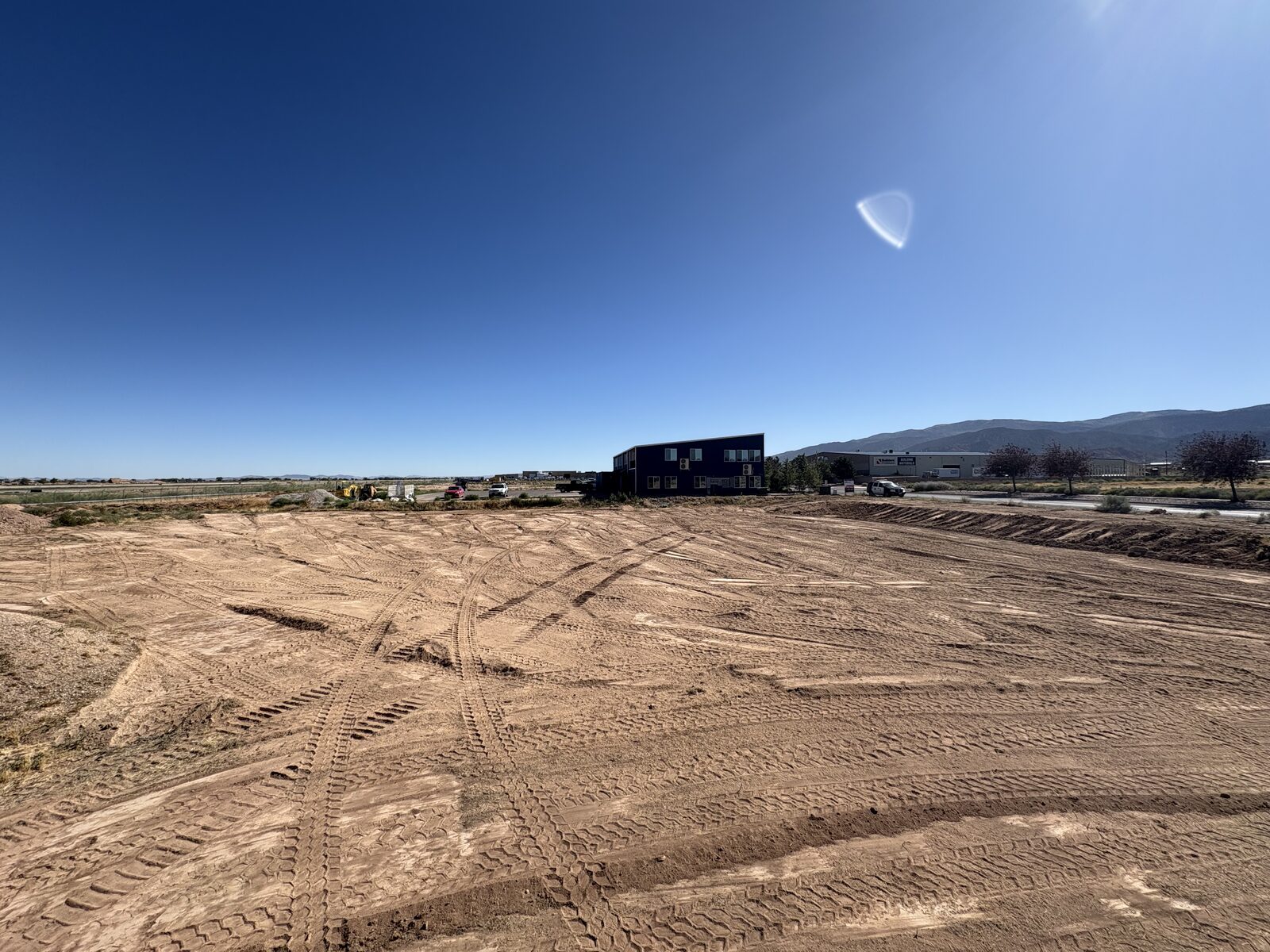 Wide finished commercial building pad graded by Roxor South in the St. George, Utah area