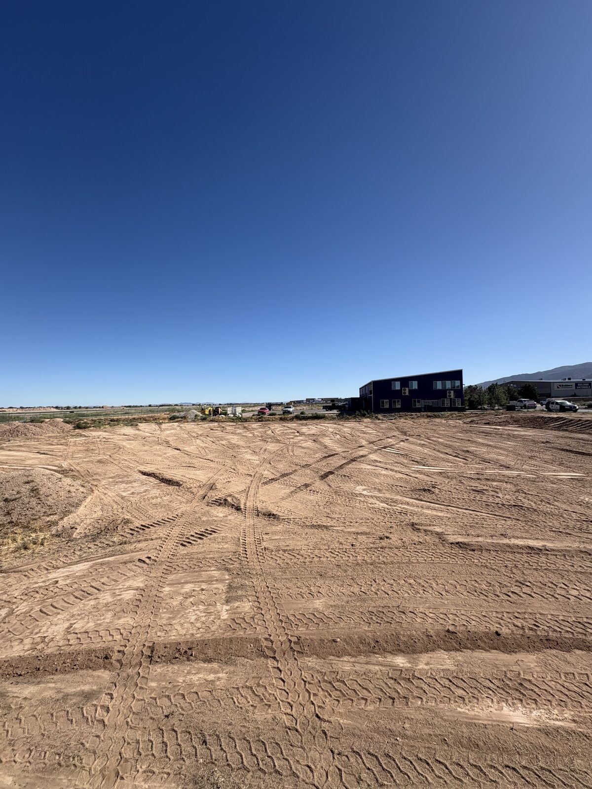 Smoothly graded commercial building pad finished by Roxor South in Southern Utah